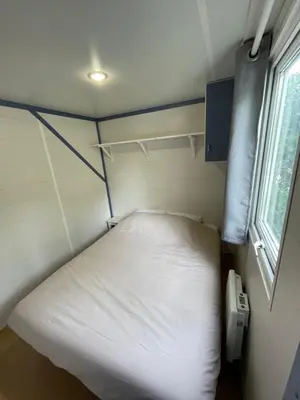 Un ou plusieurs lits dans un hébergement de l'établissement Bungalow 2/4 personnes dans résidence Hôtelière