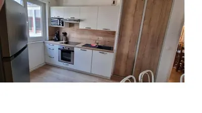 Cuisine ou kitchenette dans l'établissement L'Appart de Villefontaine + Parking gratuit à proximité