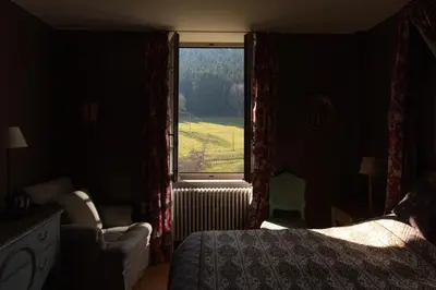 Un ou plusieurs lits dans un hébergement de l'établissement Château de Pramenoux