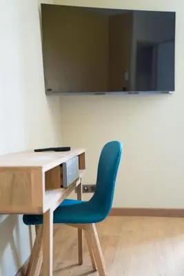 Télévision ou salle de divertissement dans l'établissement Gite du chateau