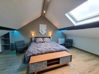 Un ou plusieurs lits dans un hébergement de l'établissement Gite du chateau