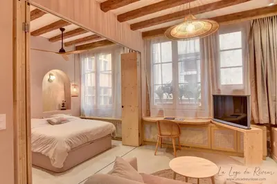 Un ou plusieurs lits dans un hébergement de l'établissement La Loge du Rêveur - Spa - Vieux-Lyon