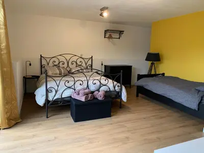 Un ou plusieurs lits dans un hébergement de l'établissement Le Gîte de Félix - Maison chaleureuse 190m2 - 6 ch - 20pers