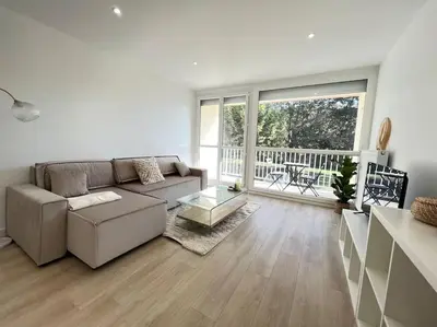 Coin salon dans l'établissement Le Chantereine appartement résidentiel
