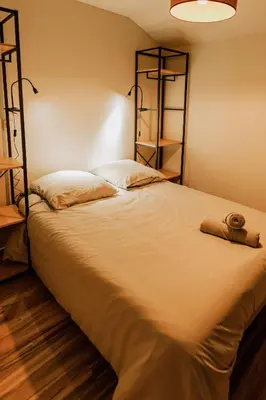 Un ou plusieurs lits dans un hébergement de l'établissement UM studios - Charmants studios tout équipé - wifi