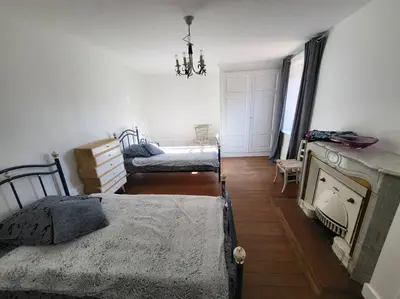 Un ou plusieurs lits dans un hébergement de l'établissement Gite la ferme des maraîchers