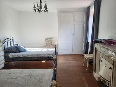 Un ou plusieurs lits dans un hébergement de l'établissement Gite la ferme des maraîchers