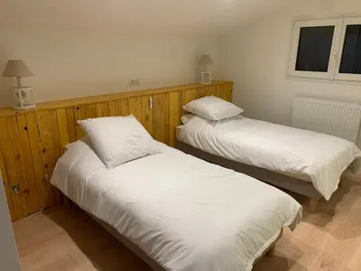 Un ou plusieurs lits dans un hébergement de l'établissement Gîte chez GAREL 15 personnes avec spa