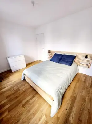 Un ou plusieurs lits dans un hébergement de l'établissement Lyon Part-Dieu superbe appartement 2 chambres
