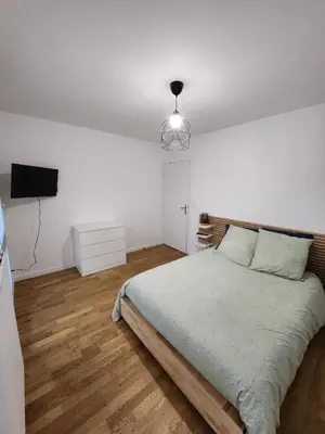 Un ou plusieurs lits dans un hébergement de l'établissement Lyon Part-Dieu superbe appartement 2 chambres