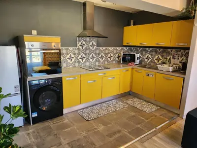 Cuisine ou kitchenette dans l'établissement L'@ppart