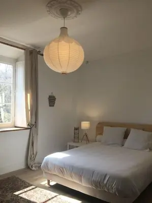 Un ou plusieurs lits dans un hébergement de l'établissement Grand appart 150m2 dans belle maison bourgeoise