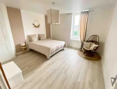Un ou plusieurs lits dans un hébergement de l'établissement Joli duplex cocooning de 100m2 avec Rez de jardin