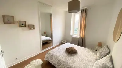 Un ou plusieurs lits dans un hébergement de l'établissement Joli duplex cocooning de 100m2 avec Rez de jardin