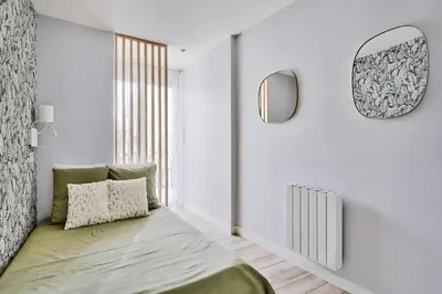 Un ou plusieurs lits dans un hébergement de l'établissement Appartement L’Élégant - Idéalement Situé