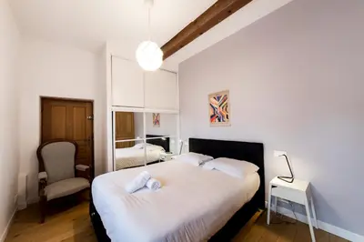 Un ou plusieurs lits dans un hébergement de l'établissement All in Lyon | Grand duplex avec vue sur Fourvière