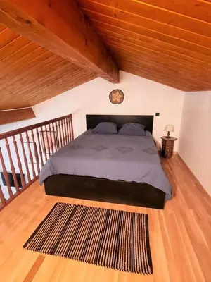 Un ou plusieurs lits dans un hébergement de l'établissement Le Chalet