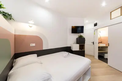 Un ou plusieurs lits dans un hébergement de l'établissement All in Lyon | Studio confortable | métro Garibaldi