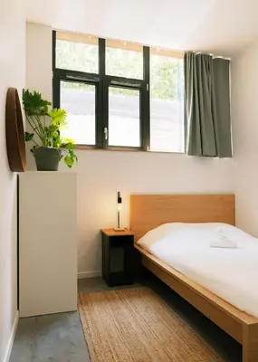 Un ou plusieurs lits dans un hébergement de l'établissement YASI Hostel