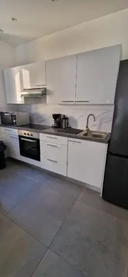 Cuisine ou kitchenette dans l'établissement Beau Appartement T2