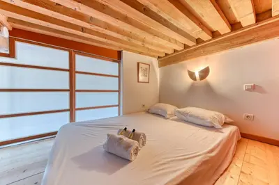 Un ou plusieurs lits dans un hébergement de l'établissement GuestReady - Canut Typique avec vue sur Lyon