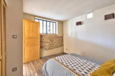 Un ou plusieurs lits dans un hébergement de l'établissement Appartement Le Cosy - Calme & Chaleureux - Bien situé