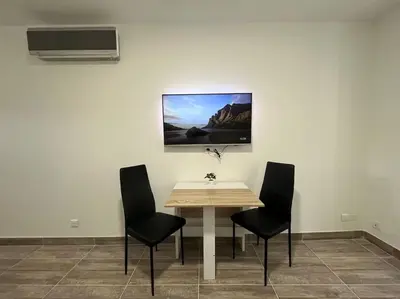 Télévision ou salle de divertissement dans l'établissement Superbe appartement à 15 min de Lyon