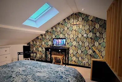 Télévision ou salle de divertissement dans l'établissement Logement indépendant 