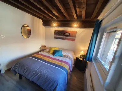 Un ou plusieurs lits dans un hébergement de l'établissement Appartement cosy dans le centre historique