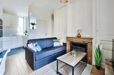 Coin salon dans l'établissement Appartement Le Somptueux - Idéalement Situé
