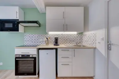 Cuisine ou kitchenette dans l'établissement L'Escale charmante & cosy - T2 - Montluel