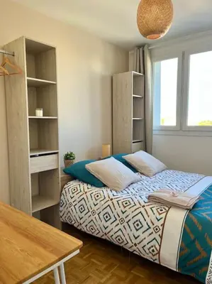 Un ou plusieurs lits dans un hébergement de l'établissement Chambre privée dans un appartement partagé