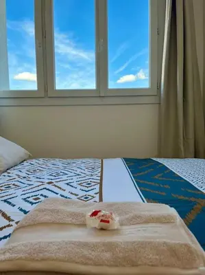 Un ou plusieurs lits dans un hébergement de l'établissement Chambre privée dans un appartement partagé