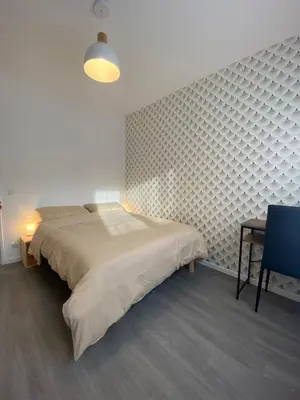 Un ou plusieurs lits dans un hébergement de l'établissement Sleep In La Mulatière
